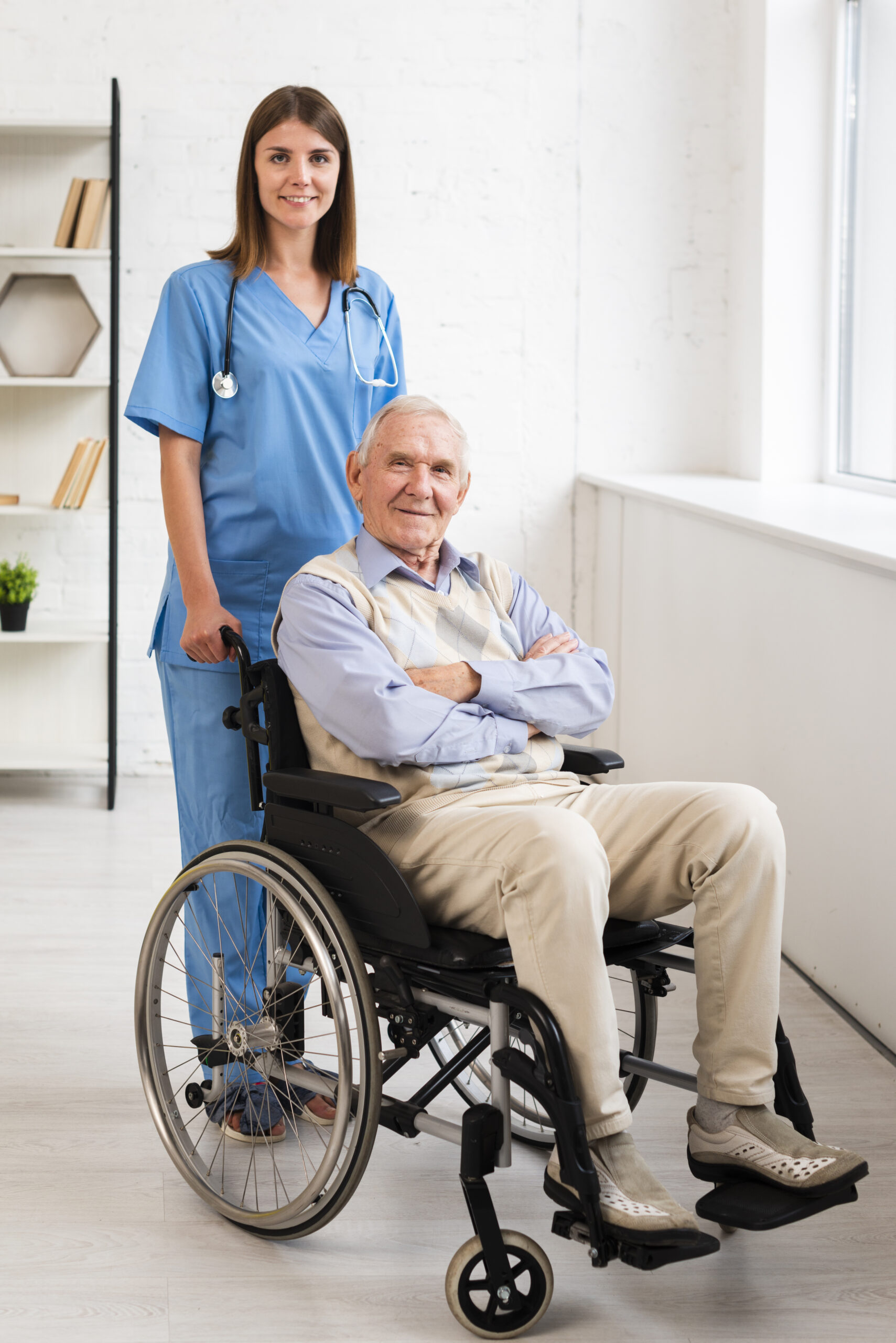 Nurse assisting a senior man in a wheelchair with home care support in the Tampa Area, FL